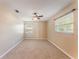 Inviting bedroom with neutral walls, plush carpeting, and large windows, creating a serene atmosphere at 172 Post And Rail Rd, Longwood, FL 32750