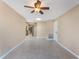 View of the dining room leading into the kitchen, which features tiled floors and neutral walls at 172 Post And Rail Rd, Longwood, FL 32750