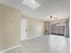 Open-concept living room with tiled floors, a ceiling fan, and a sliding glass door to the backyard at 172 Post And Rail Rd, Longwood, FL 32750