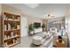 Cozy living room with stylish furniture, a ceiling fan, and a view of the backyard at 172 Post And Rail Rd, Longwood, FL 32750