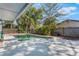 Outdoor pool featuring a mature tropical landscape creating a private oasis at 172 Post And Rail Rd, Longwood, FL 32750