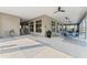 Exterior view of the pool area with water fountains, a drinking fountain, tables, chairs and overhead fans at 1807 Waggoner St, Kissimmee, FL 34744