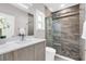 Elegant bathroom featuring a walk-in shower with glass doors, sleek vanity, and modern fixtures at 2015 Summerfield Rd, Winter Park, FL 32792