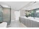 Modern bathroom featuring a double vanity, soaking tub, and a glass-enclosed shower at 2015 Summerfield Rd, Winter Park, FL 32792