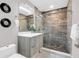 Stylish bathroom with a modern vanity, elegant tile shower, and contemporary fixtures at 2015 Summerfield Rd, Winter Park, FL 32792