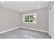 Simple bedroom with a window overlooking the front yard at 2015 Summerfield Rd, Winter Park, FL 32792