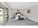 Cozy bedroom with sliding glass doors to pool, features a tufted headboard and stylish decor at 2015 Summerfield Rd, Winter Park, FL 32792