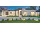 Modern home featuring manicured lawn, striking block driveway, and minimalist design at 2015 Summerfield Rd, Winter Park, FL 32792