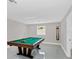 Bright game room featuring a billiard table, light gray walls, and neutral colored floors at 2015 Summerfield Rd, Winter Park, FL 32792