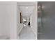 Bright hallway with recessed lighting and artwork, leading to the living areas at 2015 Summerfield Rd, Winter Park, FL 32792