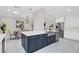 Bright kitchen with white cabinets, stainless appliances, and island with a farmhouse sink at 2015 Summerfield Rd, Winter Park, FL 32792
