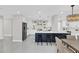 Modern kitchen featuring stainless steel appliances, white cabinetry, and an eat-in island at 2015 Summerfield Rd, Winter Park, FL 32792