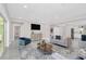 Bright open-concept living room with modern furnishings and a view to other rooms at 2015 Summerfield Rd, Winter Park, FL 32792