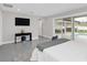 Modern main bedroom with sliding glass doors and a view of the pool at 2015 Summerfield Rd, Winter Park, FL 32792
