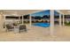 Entertainer's patio featuring an outdoor kitchen and comfortable seating near a refreshing pool at twilight at 2015 Summerfield Rd, Winter Park, FL 32792