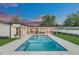Backyard pool with lush landscaping, patio furniture, and plenty of space for outdoor living at 2015 Summerfield Rd, Winter Park, FL 32792