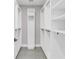 Spacious walk-in closet with ample shelving, rods, and a clean, organized design at 2015 Summerfield Rd, Winter Park, FL 32792