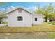 Backyard view featuring a fenced yard with a view of the back exterior of the home at 230 Hennis Rd, Winter Garden, FL 34787