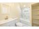 Bathroom features marble-look tile shower, bathtub, vanity, and open shelving at 230 Hennis Rd, Winter Garden, FL 34787