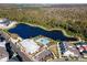 Aerial view of community featuring a pool, clubhouse, and scenic lake at 2331 Celebration Blvd, Celebration, FL 34747