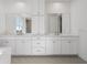 Elegant bathroom features double sinks, white cabinets, and modern fixtures at 2331 Celebration Blvd, Celebration, FL 34747