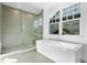 Modern bathroom showcases a freestanding tub and glass-enclosed shower with stylish tile at 2331 Celebration Blvd, Celebration, FL 34747