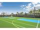 Outdoor basketball court with green and blue surfaces, perfect for sports and recreation at 2402 Dubai St, Kissimmee, FL 34747