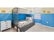 Bright bedroom with a bunk bed, and Minions themed decor, perfect for a themed room at 2402 Dubai St, Kissimmee, FL 34747