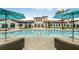 Relaxing community pool with comfortable sunbeds and umbrellas offers a tranquil escape at 2402 Dubai St, Kissimmee, FL 34747