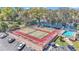 An aerial view of community tennis courts and pool with parking at 2447 Ne 7Th St, Ocala, FL 34470