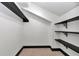 Walk-in closet with built-in shelving offers ample storage space at 2447 Ne 7Th St, Ocala, FL 34470