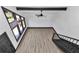 Living room has modern hard surface flooring, window and black trim at 2447 Ne 7Th St, Ocala, FL 34470