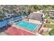 Aerial view of community pool with lounge chairs and surrounding fence at 2447 Ne 7Th St, Ocala, FL 34470