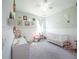 Light and airy Bedroom featuring a white crib and whimsical decor at 2715 Rowan St, Tavares, FL 32778