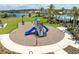 A colorful playground features slides and climbing structures in a beautiful outdoor setting at 2715 Rowan St, Tavares, FL 32778