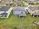 Aerial perspective of the home's backyard, with a large green lawn at 2926 Boating Blvd, Kissimmee, FL 34746