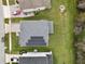 Top-down aerial shot of the home with solar panels and the surrounding neighborhood at 2926 Boating Blvd, Kissimmee, FL 34746