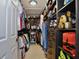 Organized walk-in closet with custom shelving and hanging racks to maximize storage and style at 2926 Boating Blvd, Kissimmee, FL 34746