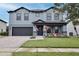 Beautiful two-story home with a brick driveway, well-kept lawn, and welcoming front porch at 2926 Boating Blvd, Kissimmee, FL 34746