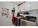 Bright laundry room with white cabinetry, laundry machine, and ample storage solutions at 2926 Boating Blvd, Kissimmee, FL 34746