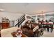 Inviting living area showcasing tile flooring, stairs, and a peek into the dining space at 2926 Boating Blvd, Kissimmee, FL 34746