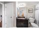 This bathroom features a dark wood vanity with granite countertops, and a toilet at 3123 Bentonshire Pl, Longwood, FL 32779