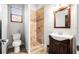 Bathroom with a framed mirror, tile shower, tile flooring, and a modern toilet at 3123 Bentonshire Pl, Longwood, FL 32779