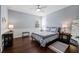 This light-filled bedroom features hardwood floors, neutral walls, and a ceiling fan at 3123 Bentonshire Pl, Longwood, FL 32779