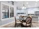 Charming dining area next to kitchen with a glass table and natural light at 3123 Bentonshire Pl, Longwood, FL 32779