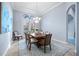 Elegant dining room showcasing modern decor, chandelier and French door access at 3123 Bentonshire Pl, Longwood, FL 32779