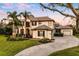 Beautiful exterior of the home, featuring lush landscaping and an expansive driveway at 3123 Bentonshire Pl, Longwood, FL 32779