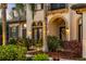 Inviting front entrance showcasing lush landscaping and elegant architectural details at 3123 Bentonshire Pl, Longwood, FL 32779