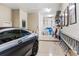 Well-lit garage featuring a modern car, storage racks, and ample space at 3123 Bentonshire Pl, Longwood, FL 32779