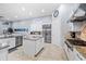 Open kitchen with stainless steel appliances, granite countertops, and white cabinetry at 3123 Bentonshire Pl, Longwood, FL 32779